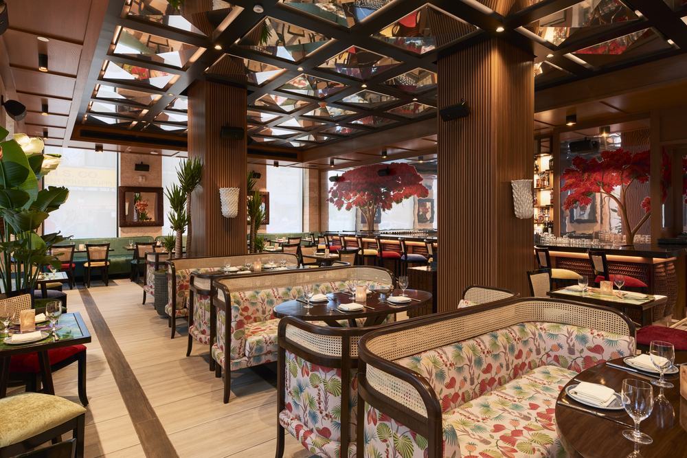A restaurant dining area with booths and tables set for meals.