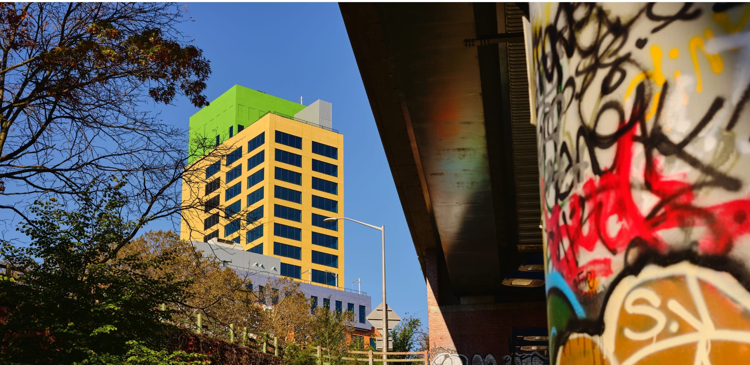 View of radio hotel from under bridge with graffiti